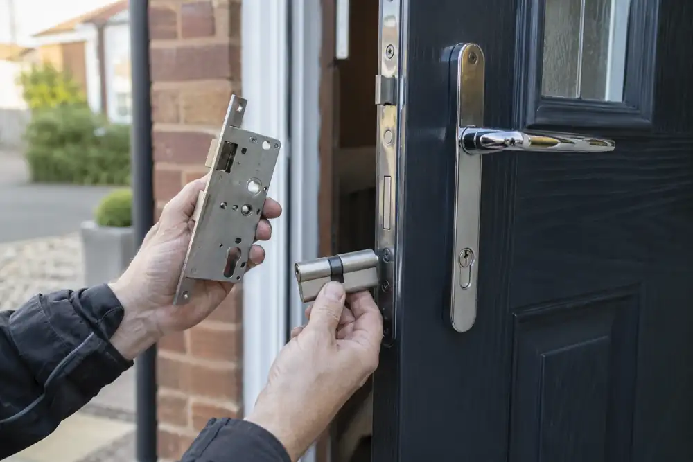 Replacement cylinder and mechanism beside dark composite front door.